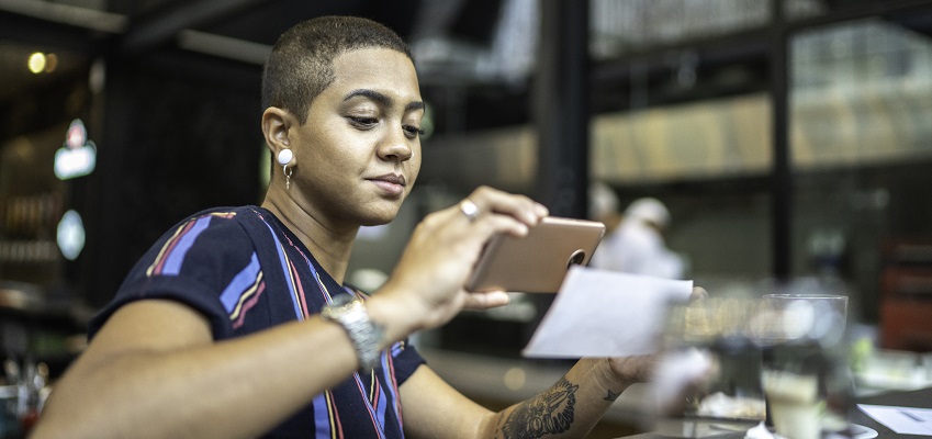 Employee depositing a check using a phone