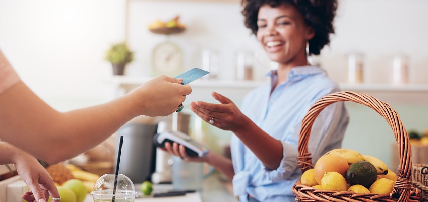 Female restaurant worker receiving a card