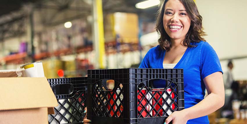 Woman carrying a crate