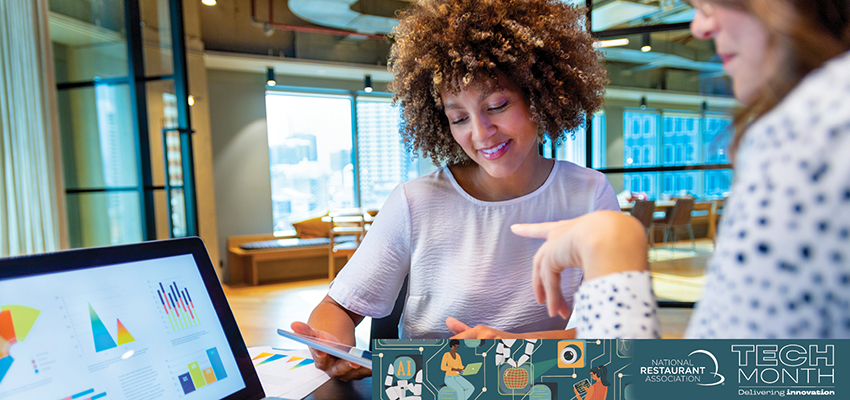 Two women looking at an iPad